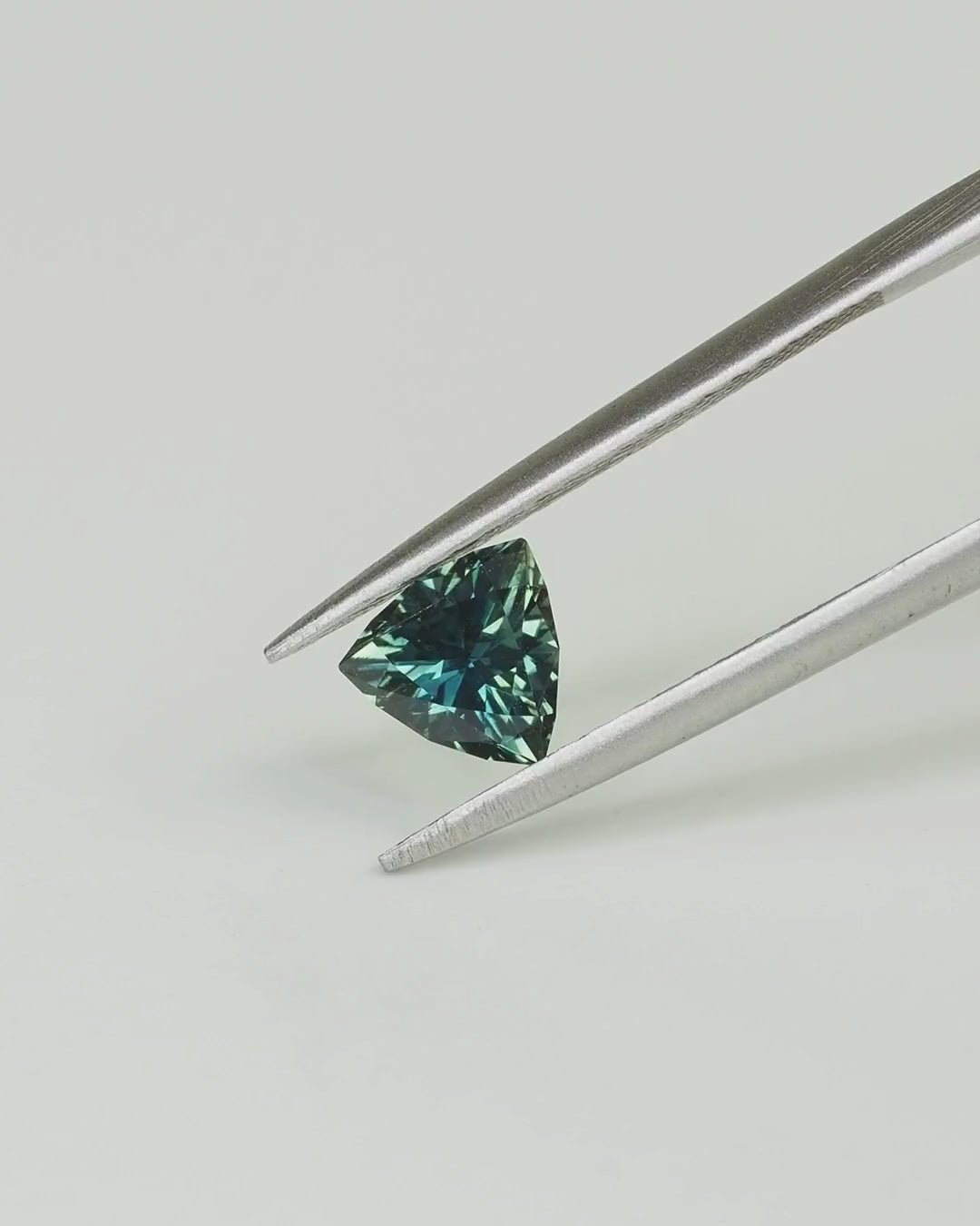 Load and play video in Gallery viewer, Australian  Sapphire — Trilliant Cut
